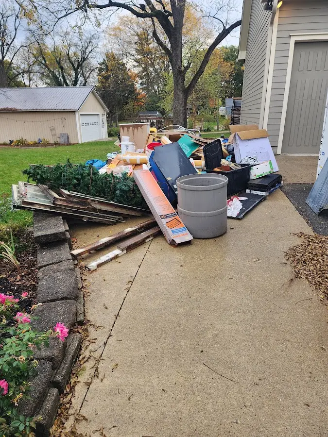 Dumpster being loaded with debris for 10 Yard Dumpster Rental in Bound Brook